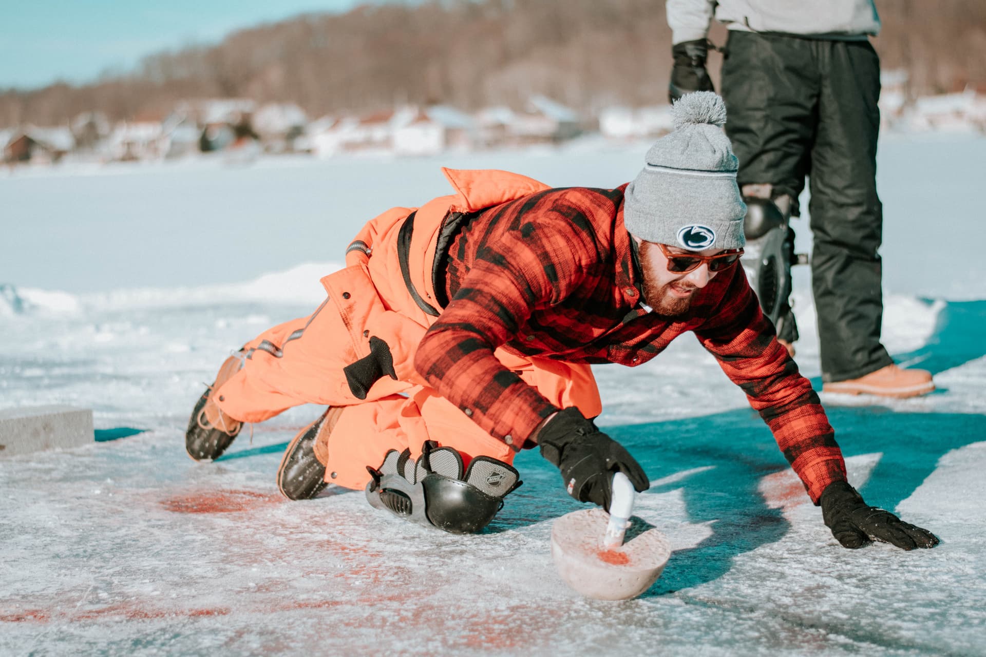 Man enjoying a game of curling on holiday